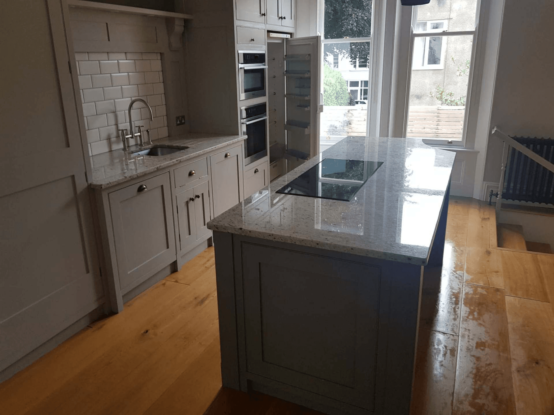 Period-property shaker kitchen with granite island after end of tenancy clean in Bristol